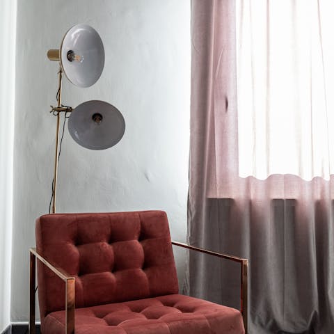 A tufted maroon armchair